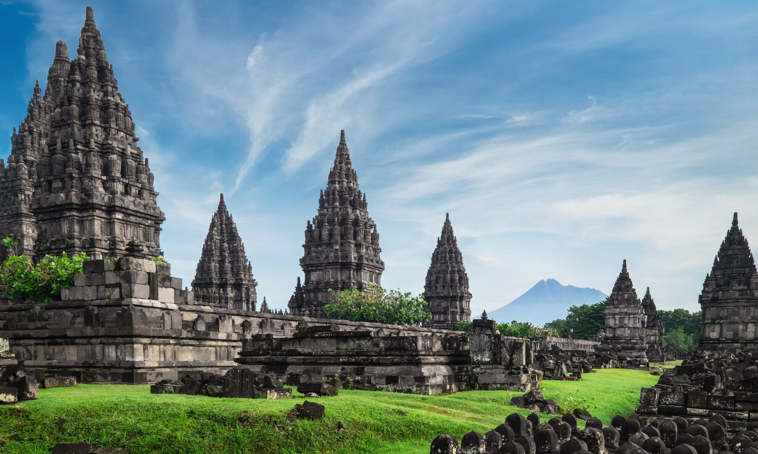 Ancient,Stone,Ruins,On,Green,Field,And,Candi,Prambanan,Or